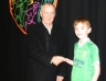 James Laverty Naomh Mhuire Aghagallon collects his award in Storytelling from Ulster Treasurer Michael Hasson